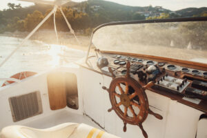Blog sun shines over wooden boat in the sea